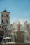 Fountain on a square in front of buildings at Merida