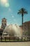 Fountain on a square in front of church at Merida