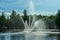 Fountain squirting water in bright summer sunlight