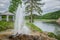 Fountain on the stone Bank of the river