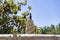 Fountain. Stone fountain filled with water with a jet of water at its tip in a park in Madrid on a clear day with a blue sky