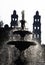 A fountain and the towers of MoreliaÂ´s Cathedral