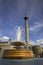 Fountain in Trafalgar square with nelsons column in background