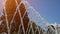 Fountain with water jets falling on center in city park at summer day.