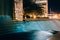 Fountains and buildings at night at Woodruff Park in downtown At