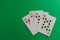 Four 10 cards of a poker deck over a green background