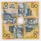Four 50 Australian dollar bills in a square arrangement