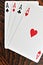 Four Aces - Playing Cards on Wooden