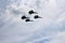 Four aircraft combat fighters a great strong powerful SU-34 military fighters flying in the sky