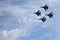 Four aircraft SU-34 military fighters flying in the sky