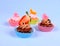 Four appetizing cupcakes with angel, heart, tangerine, strawberry