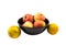 Four apple in black bowl and two orange still life on white back