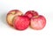 Four apples on white background. Red juicy ripe apples close up. Fresh striped fruit. Side view