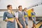 Four attractive aircrew members standing by a landed aircraft