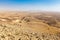 Four backpackers hiking trail, Negev desert, Israel.