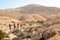 Four backpackers hiking trail, Negev desert, Israel.