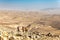 Four backpackers hiking trail, Negev desert, Israel.