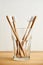 Four bamboo toothbrushes in a glass