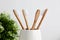 Four bamboo toothbrushes in gray glass