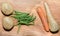 Four basic vegetable on old wooden board