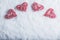 Four beautiful romantic vintage hearts on a white frosty snow background. Love and St. Valentines Day concept.