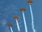 Four Biplanes with Smoke Climbing