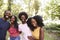 Four black adult friends on a walk in the forest, portrait