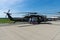 A four-bladed, twin-engine, medium-lift utility helicopter HH-60M Black Hawk MEDEVAC.