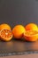 Four blood oranges, one halved