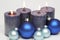 Four blue candles and blue christmas tree balls