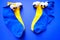 four bright blue socks with funny eyes on a blue background. Puppet theatre. View from above.