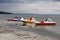 Four bright multi-colored catamarans moored to the shore. Riga seaside Baltic Sea before a thunderstorm