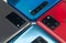 Four bright multicolored modern smartphones with different foto camera modules close-up. Selective focus