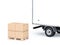 Four Brown Cardboard parcel boxes on euro pallet near Truck