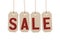 Four brown tags with word sale