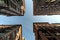 Four buildings overhead and the sky.