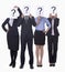 Four business people holding up paper with question mark, obscured face, studio shot