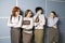 Four businesswoman standing in line