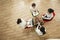 Four businesswomen working on the project sitting in a circle, overhead shot