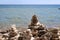 Four cairns at the water`s edge on a rocky shoreline of Lake Michigan in Cave Point County Park, Sturgeon Bay, Wisconsin