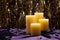 Four candles over purple velvet