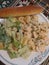 Four cheese tortellini and Caesar salad with a tasty breadstick