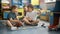 Four children are playing on the floor with toys