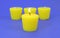 Four citronella candles with one lit