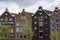 Four classic dutch houses under the cloudy sky