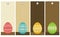 Four color easter eggs over wooden labels