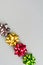 Four color festive bows over grey background