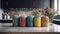 Four colorful canisters sit on a counter in a kitchen