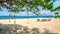 Four colorful deckchairs on the beach