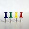 Four colorful push pins with shadow